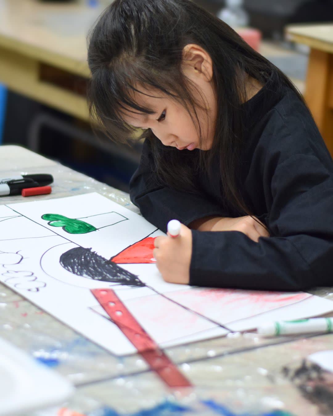 Camper drawing at art camp