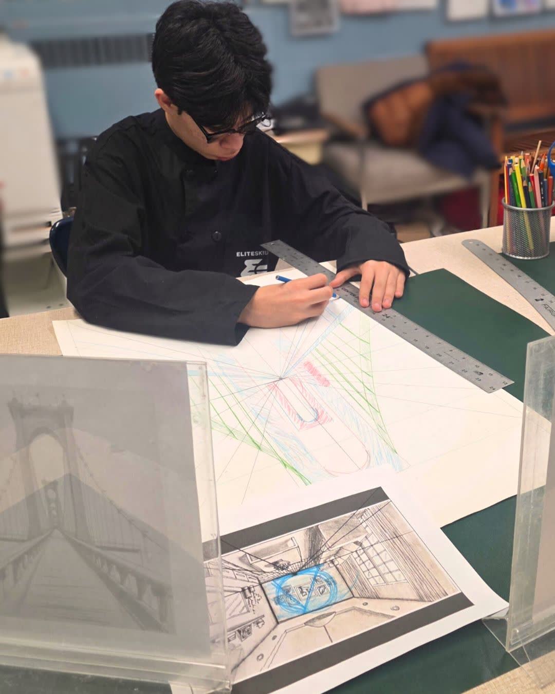Student working on a perspective drawing
